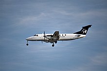 A Beechcraft 1900C, flown by Pacific Coastal Airlines, landing at Vancouver International Airport