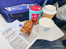 An IndiGo in-flight snack of biscuits supplied in a souvenir biscuit tin