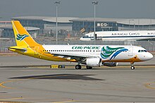 Cebu Pacific's first Airbus aircraft, an A320-200 (wearing the 2005–2016 livery), as pictured at Hong Kong International Airport in December 2005.